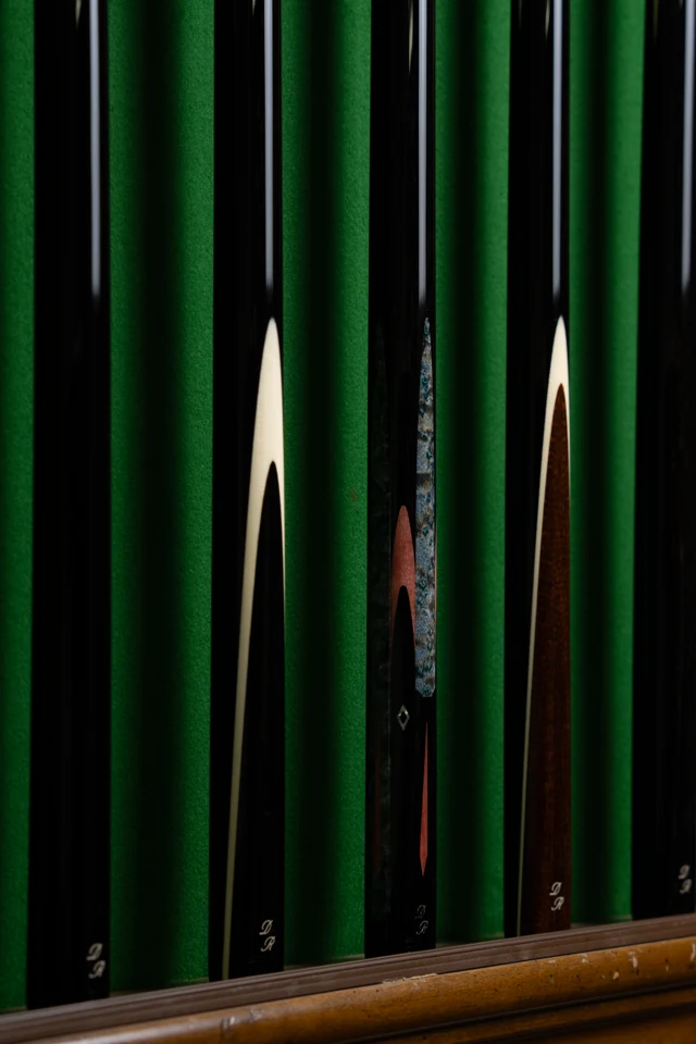 2 Cues On A Rack